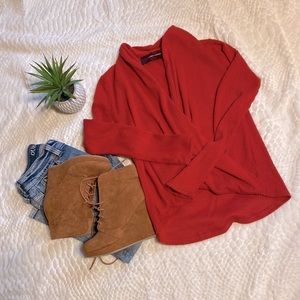CODEXMODE red low plunge twist sweater.